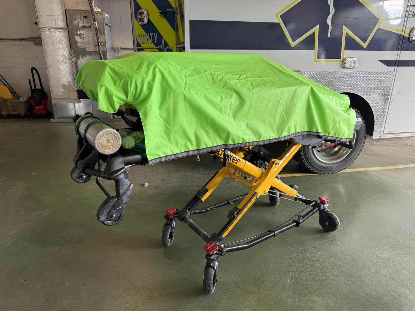 Cover on stretcher outside fire station